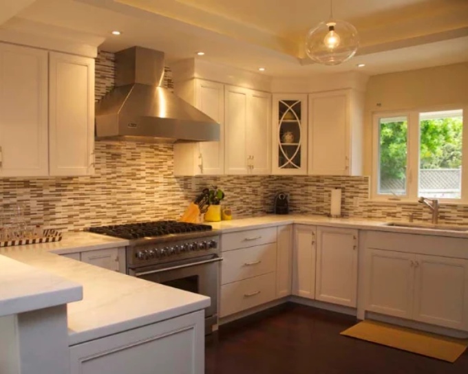 Top Kitchen Upgrades Featuring White Cabinetry, Quartz Counters And Linear Tile Backsplash